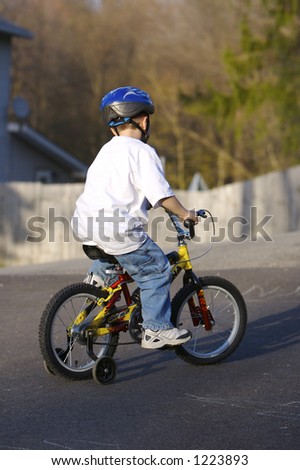 Child on Bike with Training Wheels