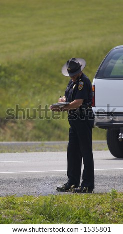 Police Officer Writing Ticket or Accident Report