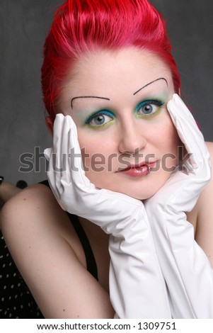 goth/glam model with hands framing face
