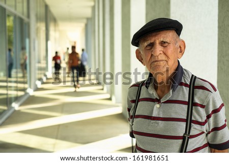 Elderly eighty plus year old man portrait in a outdoor setting.
