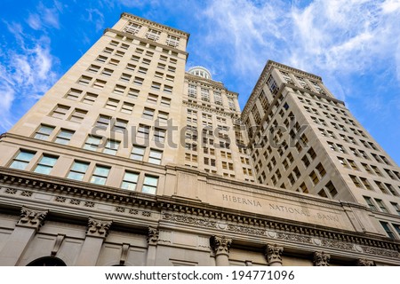 NEW ORLEANS, LOUISIANA USA - MAY 4,2014: The historic Hibernia National Bank building, completed in 1921, located on Gravier Street in the central business district in New Orleans, Louisiana.