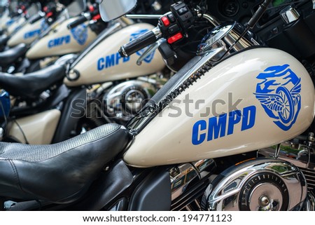 CHARLOTTE, NORTH CAROLINA USA - OCTOBER 10, 2013: Charlotte police department motorcycles lined up outside a municipal downtown building.