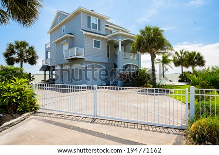TIKI ISLAND, TEXAS USA - MAY 6, 2014: The village of Tiki Island, located on a small peninsula in Jones Bay in Galveston County, is a popular coastal community containing beautiful waterfront homes.