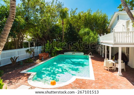 Key West, Florida USA - March 2, 2015: A pretty swimming pool and guest house in the historic district of Key West.