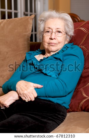 Elderly 80 year old woman in a home lifestyle scene.