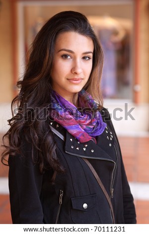 Pretty multicultural young woman at an outdoor shopping mall.