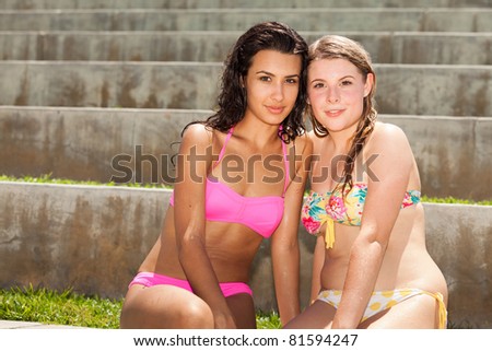 Pretty young blond and brunette women enjoying South Pointe Park in Miami Beach.