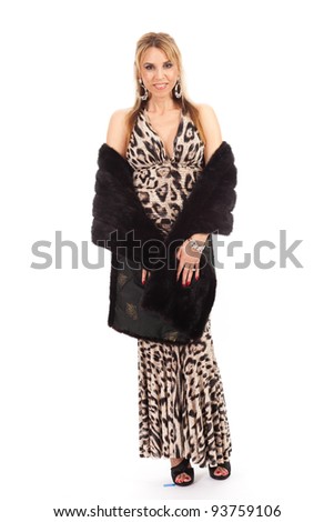 Beautiful middle age woman wearing a formal evening gown isolated on a white background.
