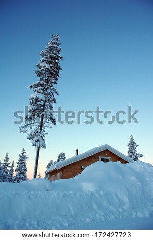 Swedish wooden house in a wintry landscape