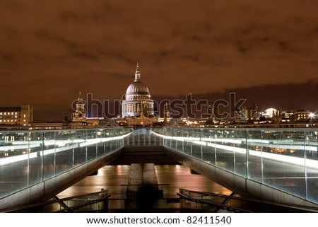 St. Paul\'s Cathedral at night. No construction cranes visible in image. Viewed from the Millennium Bridge over the River Thames.