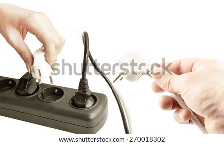 The process of connecting different plugs into a wall outlet on a white background