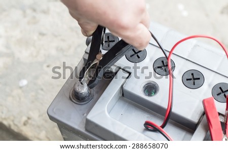 The process of connecting the charger to the the vehicle battery for charging