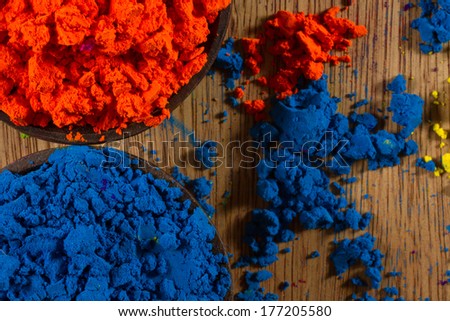 Colorful, finely powdered Indian pigments. Complementary colours: blue and orange.