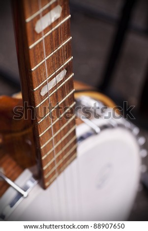 Vintage banjo for sale at a market in London. Selective focus on strings.