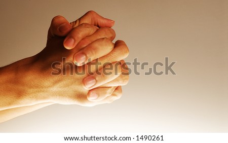 Hands in action - Clasped hands in position of prayer, concept for hoping, etc.