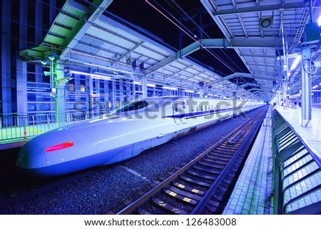 KYOTO - JANUARY 28: Japan\'s Bullet Train makes a brief stop January 21, 2013 in Kyoto, JP. The Tokkaido Shinkansen is the world\'s busiest high-speed rail line carrying 151 million passengers annually.
