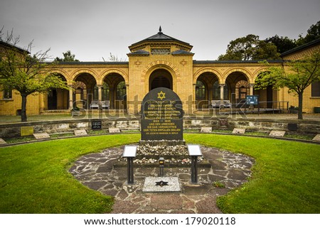 BERLIN, GERMANY - SEPTEMBER 18, 2013: The Weissensee Jewish Cemetery entrance building in Weissensee neighborhood. The cemetery was established in 1880 and remained undamaged through the Nazi regime.