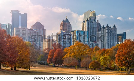 Atlanta, Georgia, USA midtown skyline from Piedmont Park in autumn in the afternoon.