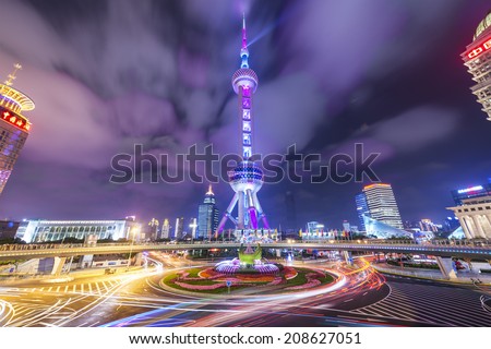 SHANGHAI, CHINA - JUNE 18, 2014: The landmark Oriental Pearl Tower at night in Lujiazui Financial District. The tower was the tallest building in China from 1994-2007.