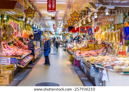 HAKODATE, JAPAN - OCTOBER 25, 2012: Workers set up for the morning market. The collection of over 300 stalls operates daily from 5 a.m. and is a popular early morning attraction.