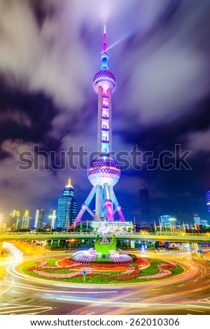 SHANGHAI, CHINA - JUNE 18, 2014: The landmark Oriental Pearl Tower at night in Lujiazui Financial District. The tower was the tallest building in China from 1994-2007.