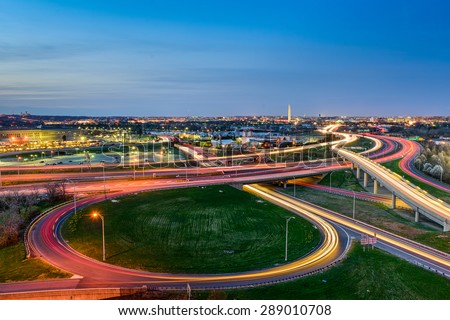 Washington, D.C. skyline with highways and monuments.