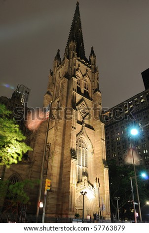Trinity Church and its steeple at night in New York City.