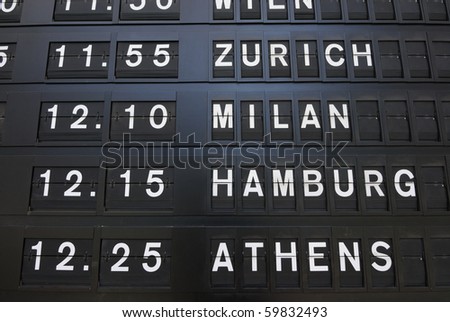 Departure times on an analog sign.