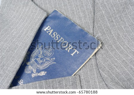 A blue American Passport in a suit coat pocket.