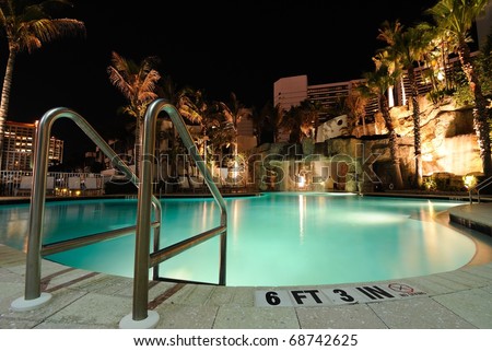 A resort swimming pool at night
