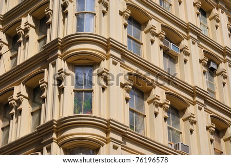 Bay window at the corner of an ornate apartment building