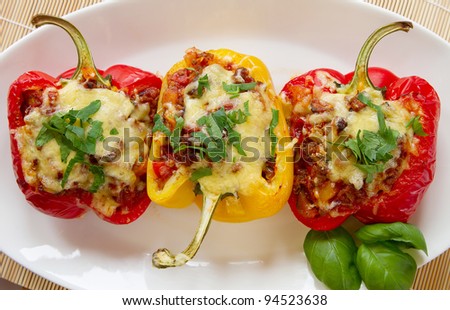Baked stuffed red bell pepper filled with minced meat, onion, rice, tomato and green onion