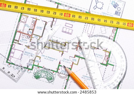 Top view of a tape measure, pencil and other tools on top of floor plan