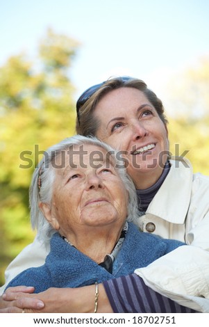 Happy elderly mother with her daughter