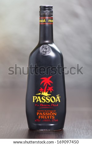 ZAGREB, CROATIA - DECEMBER 27, 2013: Bottle of Passoa, a passion fruit liqueur made in France, with mango, pineapple, and coconut flavors. It\'s red colored and is 20% ABV.