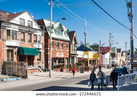 TORONTO, CANADA - MAY 2, 2007: Houses on College Street West, a district in Toronto, Ontario, also known as Little Italy, renowned for its numerous Italian Canadian restaurants and businesses.