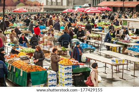 ZAGREB, CROATIA - JANUARY 7 2011: Customers and sellers at Dolac, the famous open air farmer\'s market of agricultural products in Zagreb, one of city\'s most notable landmarks.