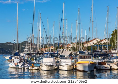 VELI IZ, CROATIA - AUGUST 15, 2014: Yachts parked and tied in the marina in city harbour in Veli Iz, on island Iz. Veli Iz is largest settlement on the island Iz.