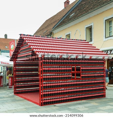 VARAZDIN, CROATIA - AUGUST 31, 2014: Coca Cola stand made of plastic bottles of Coca Cola during Varazdin Spanirfest festival. Coca Cola Company is leading soda drinks manufacturer in the world.