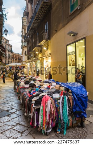 PALERMO, ITALY - OCTOBER 22, 2014: Street with shops in front of stores in Palermo center. Palermo is capital of both the autonomous region of Sicily and the Province of Palermo.