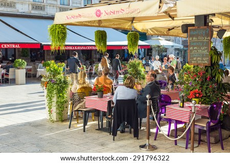 SPLIT, CROATIA - MAY 28, 2015: People in the restaurant on the main square in Split, Croatia. Split is the largest city of Dalmatia and second most largest city in Croatia.