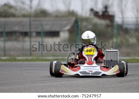 BUCHAREST, ROMANIA - APRIL 9: David Dugaesescu competes in National Karting Championship on April 9, 2011 in Bucharest, Romania.