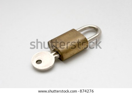 This is a closed padlock with its key.