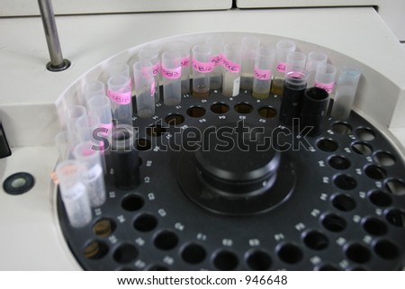 Labeled test tubes placed in a centrifugal machine to make certain type of investigation or analysis.