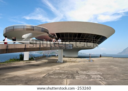 Tourists visit the Museum of Contemporary Art, Niterói, designed by Oscar Niemeyer. The museum is located in Rio de Janeiro.