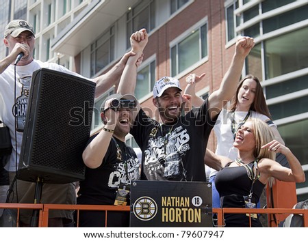 BOSTON, MA, USA - JUNE 18: Nathan Horton celebrates the Stanley cup victory at the Boston Bruins parade after winning the cup for the first time in 39 years, June 18, 2011 in Boston, MA, United States