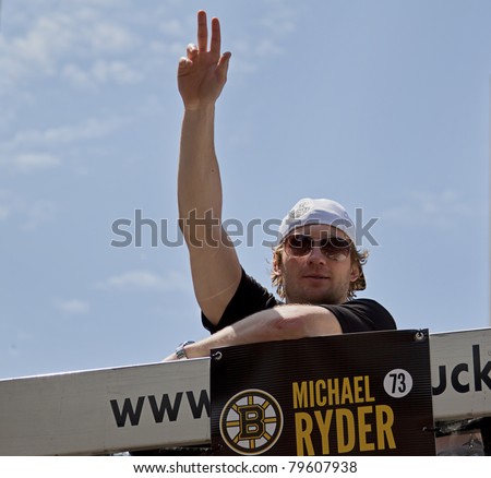 BOSTON, MA, USA - JUNE 18:  Michael Ryder celebrates the Stanley cup victory at the Boston Bruins parade after winning the cup for the first time in 39 years, June 18, 2011 in Boston, MA United States