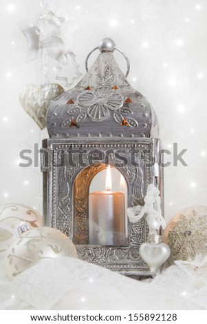 Close up of silver metal lantern with candle lights