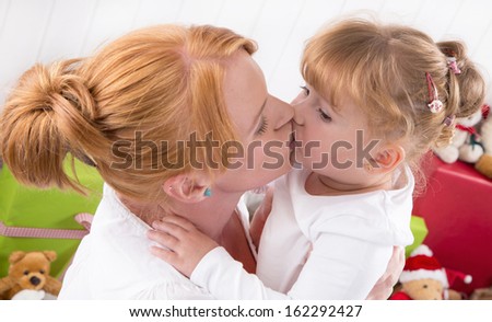 Unconditional love - a Kiss - mother and daughter