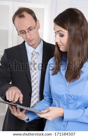 Business man and woman working together - Meeting at office